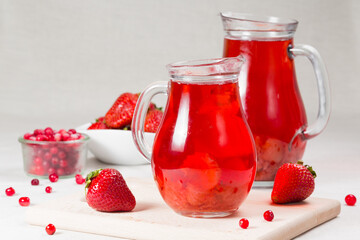 strawberry jam in a jar and berries