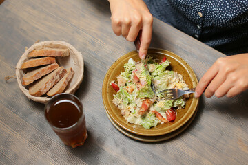 caesar salad on a white plate with sauce