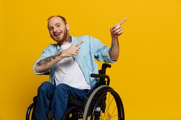 A man in a wheelchair problems with the musculoskeletal system looks at the camera shows a finger...