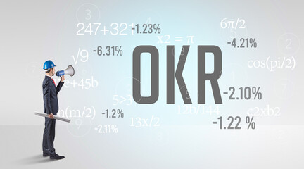 Engineer in hard hat with abbreviation