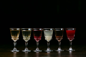 Set of alcoholic cocktails in shot glasses  isolated on black, alcoholic beverages
