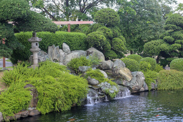 Fototapeta na wymiar Tranquil Koi Pond at Vinhomes Central Park, Ho Chi Minh city