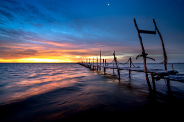 Wooden bridge on the beach at dawn in Phu Quoc island, Vietnam. Long exposure time