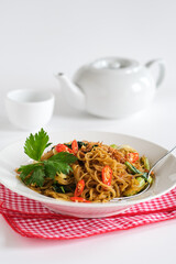 bihun goreng or stir fried rice vermicelli with vegetables and chili. a  food with delicious, spicy and sweet taste 