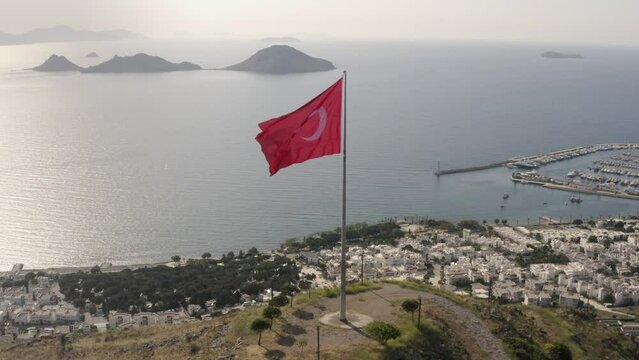 Turkish flag waving in Bodrum town shore.