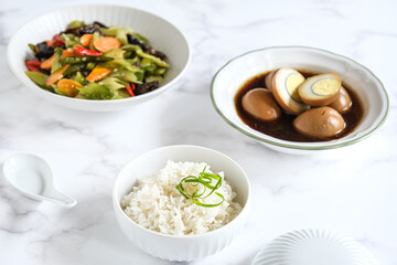 cooked rice in white ceramic bowl