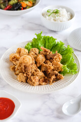 fried squid in white ceramic plate
