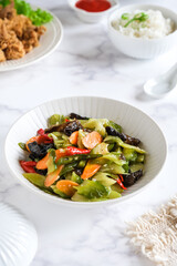 fried mixed vegetables, rice and dish