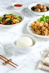 cooked rice in white ceramic bowl