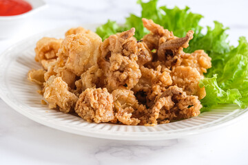 fried squid in white ceramic plate
