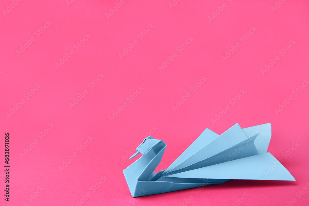 Poster Light blue paper swan on pink background, space for text. Origami art