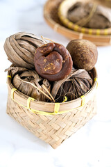 gula aren , palm sugar wrapped in leaves