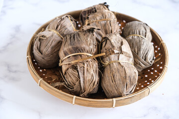 gula aren , palm sugar wrapped in leaves