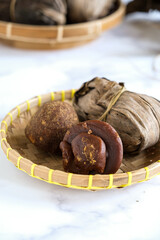 gula aren , palm sugar wrapped in leaves