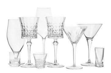 Different elegant empty glasses isolated on white