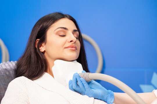 coolsculpting procedure in cosmetology clinic, cosmetologist doctor makes procedure for removing fat from the chin