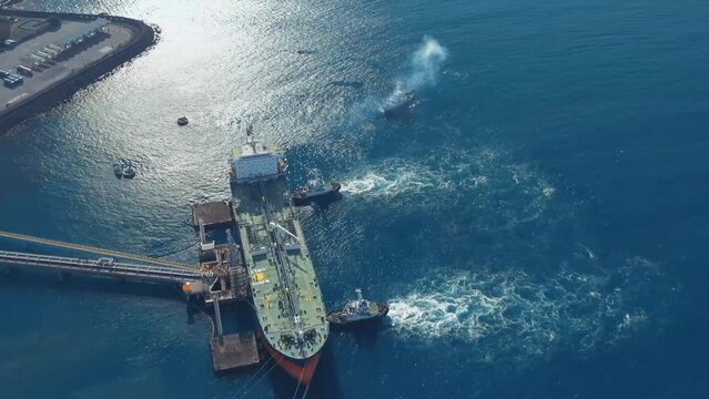Cargo terminal Jeddah Port, Saudi Arabia. Aerial view of a tanker refueling with oil.