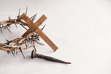 Fototapeta na wymiar Jesus Crown Thorns and nails and cross on a white background. Crucifixion Of Jesus Christ. Passion Of Jesus Christ. Concept for faith, spirituality and religion. Easter Day