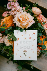 Vertical shot of Mother's Day card and flowers