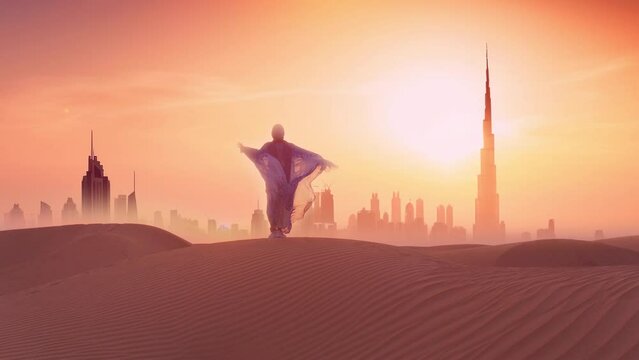 Woman in traditional arab dress stands on the mountains and rises her hand. Dubai city silhouette on the background