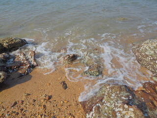 Landscape view of bubble wave on the beach. Rest and relax in vacation concept.