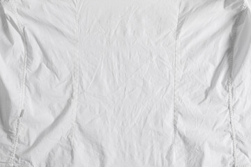 Crumpled white fabric as background, top view