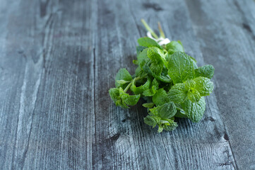 fresh mint on wooden table