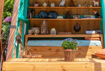 Fototapeta na wymiar Flower pot and store room in backyard garden