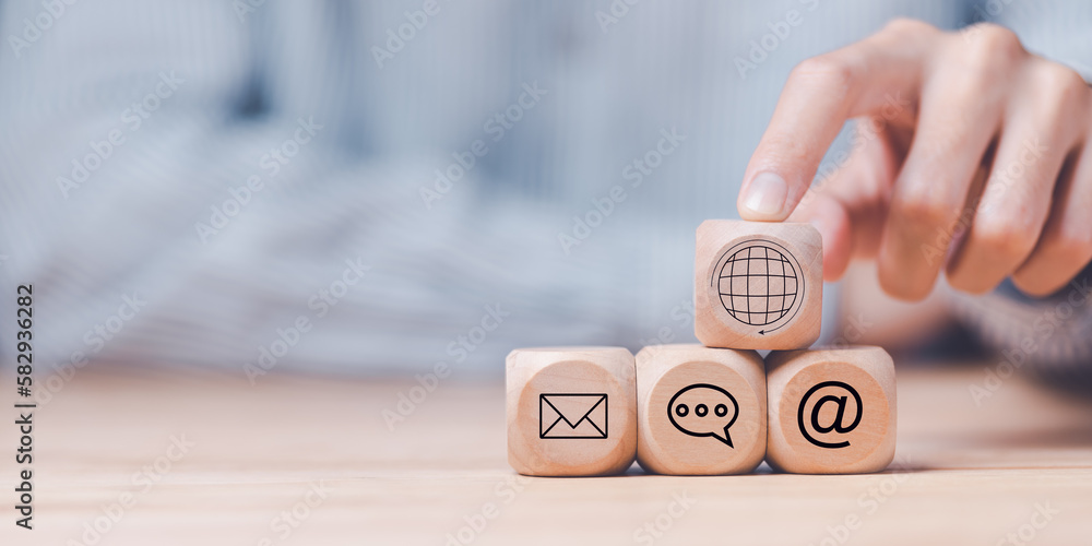 Poster man pointing at a wooden block,communication concept with email, message box and contacts icons,webs