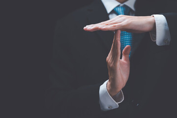 Businessman showing hand sign ,pause or request a break ,time out gesture sign ,time for a break...