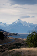 New Zealand landscape with mountains and lake with dramatic sky