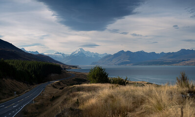 New Zealand landscape with mountains and lake with dramatic sky