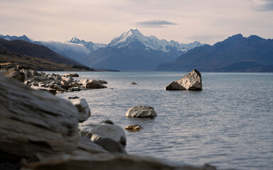 Fototapeta na wymiar New Zealand landscape with mountains and lake with dramatic sky