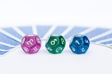 Colorful dice divination with tarot card on background, astrological dices fortune telling...