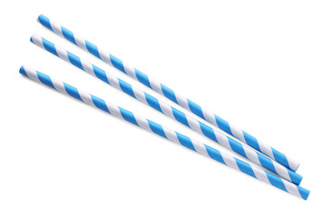 Striped paper cocktail straws on white background, top view