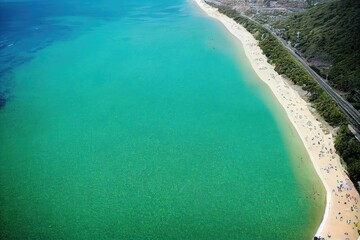 Fototapeta na wymiar An aerial view of a beautiful tropical beach in the summer