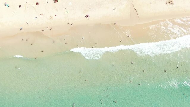 Bali, aerial view of a beach - blue transparent ocean and white sand.

