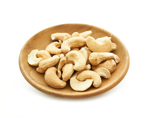 cashew nut in wood plate isolated on white background. pile of cashew nut isolated on white background. cashew nut isolated                      