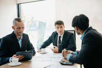  Business people sum up the results of their work in the company during the year, new project in office.