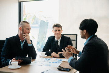  Business people sum up the results of their work in the company during the year, new project in office.