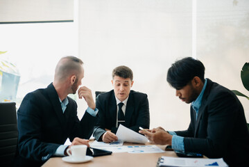  Business people sum up the results of their work in the company during the year, new project in office.