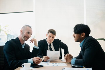  Business people sum up the results of their work in the company during the year, new project in office.