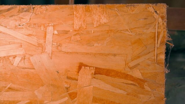 Oriented strand board close up, smooth camera movement