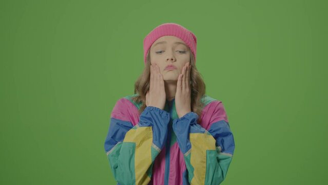 Vertical Video, Green Screen. Upset Girl of 80-90's Style Cover Face with Hands, Puffed Out Her Cheeks, Angry, Nervous. Concept of Emotional Atmosphere, Emotional Experience