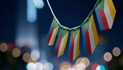 A garland of Comoros national flags on an abstract blurred background