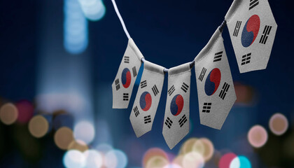 A garland of South Korean national flags on an abstract blurred background