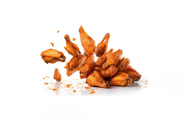 Tasty falling fried spicy chicken wings isolated on white background. Created with Generative AI Technology