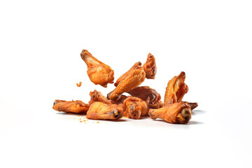 Tasty falling fried spicy chicken wings isolated on white background. Created with Generative AI Technology