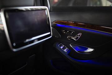 Obraz na płótnie Canvas Multimedia screen for rear passenger seats inside comfortable sedan luxury car transfer 