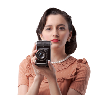 Beautiful woman taking pictures with vintage camera